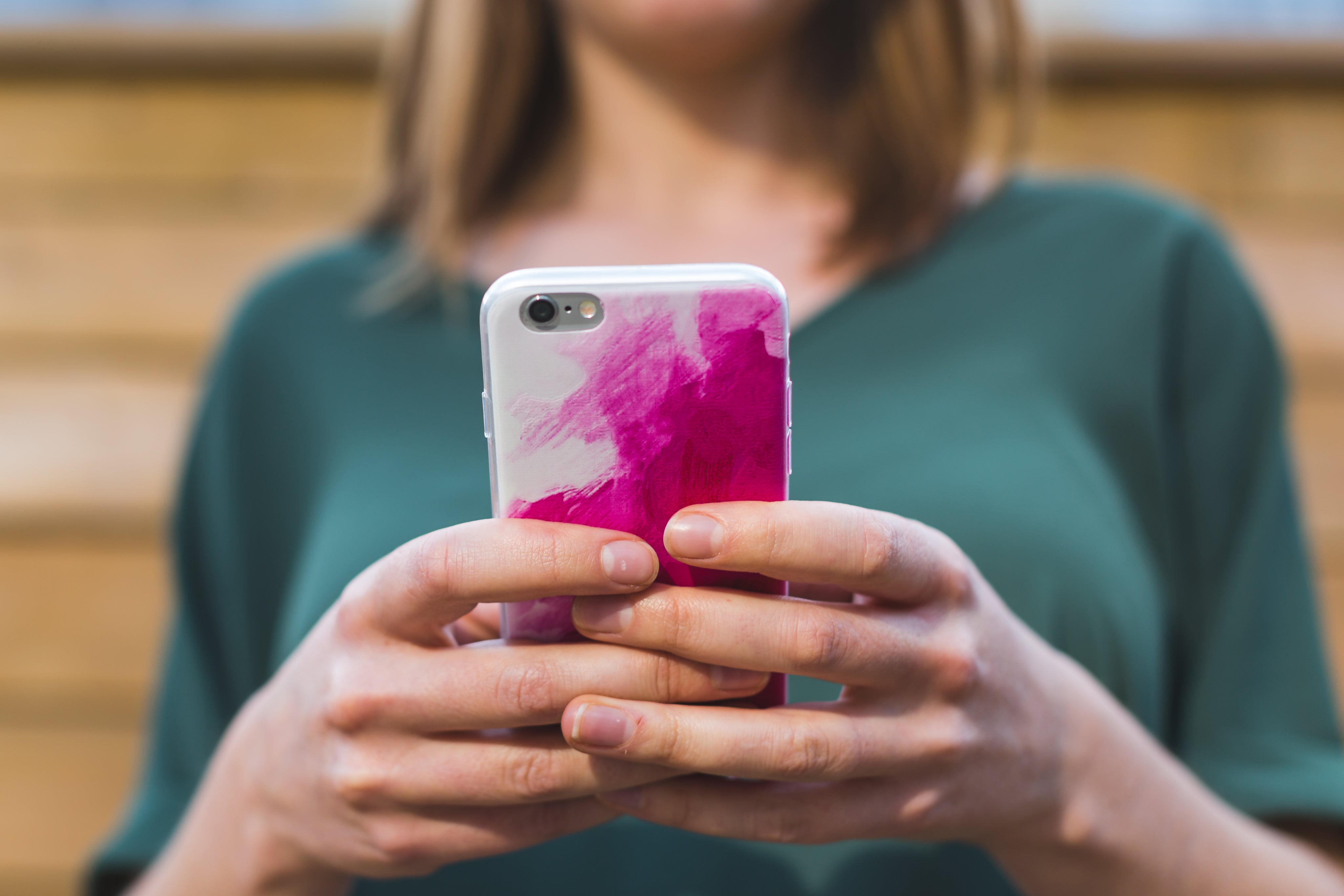woman-using-pink-smart-phone.jpg